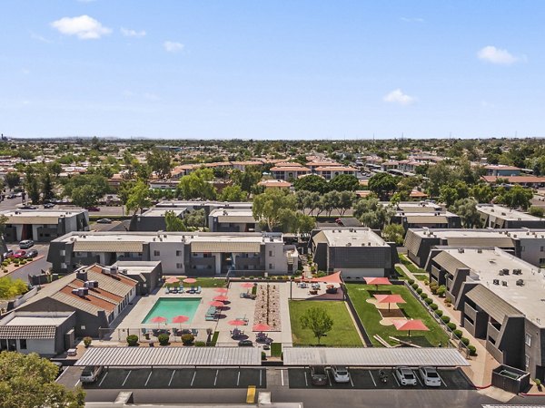 Highland Park Apartments: Expansive outdoor view with lush greenery and walking paths