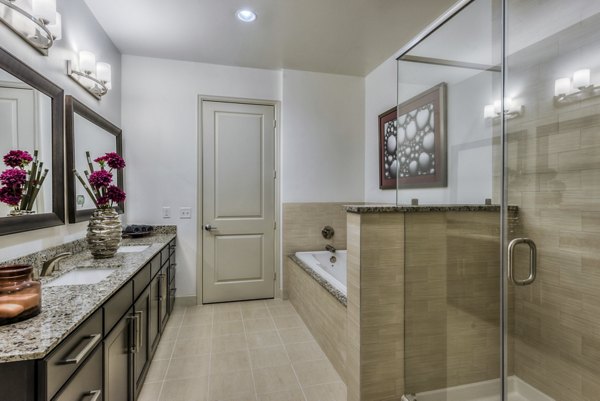 Modern bathroom with sleek fixtures at WaterWall Place Luxury Apartments