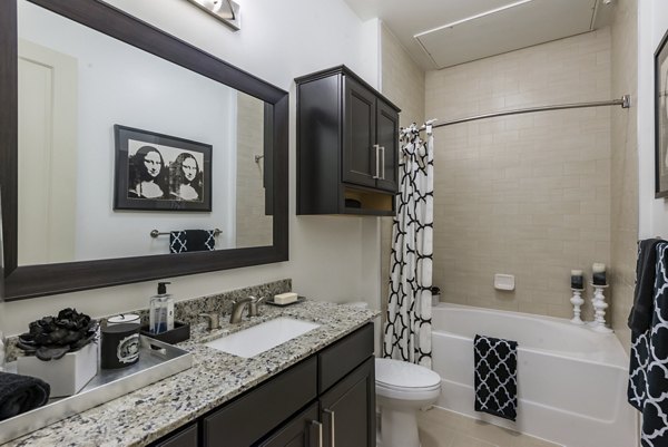 Elegant bathroom with marble countertops at WaterWall Place Luxury Apartments in Houston