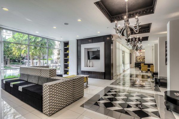 Clubhouse featuring modern lounge areas and entertainment space at WaterWall Place Luxury Apartments