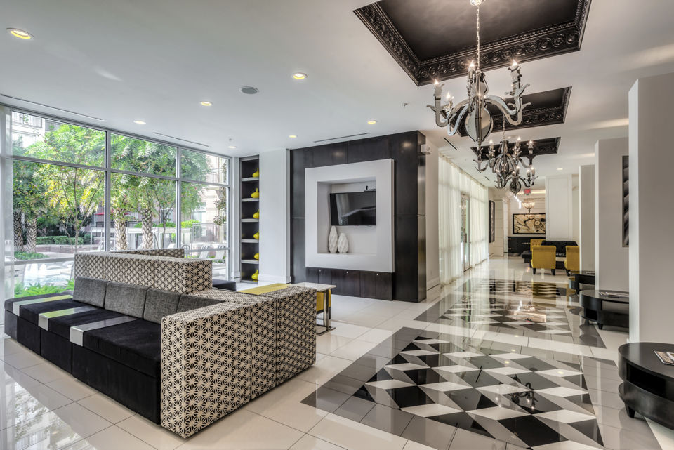 Clubhouse featuring modern lounge areas and entertainment space at WaterWall Place Luxury Apartments