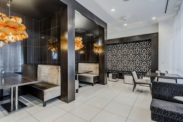 Stylish clubhouse with modern decor at WaterWall Place Luxury Apartments