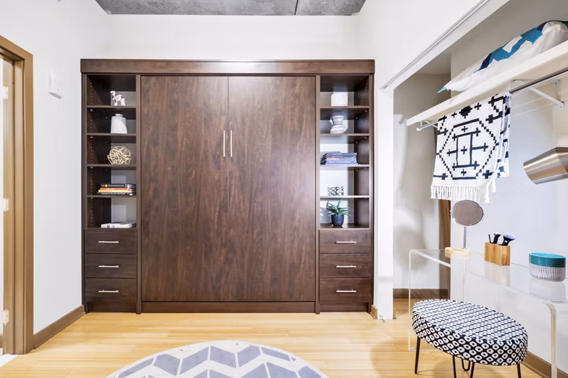 Sophisticated bedroom featuring plush bedding and modern decor in The Granary Apartments
