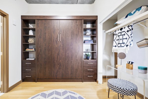 Sophisticated bedroom featuring plush bedding and modern decor in The Granary Apartments