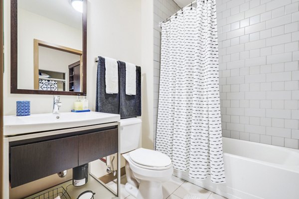 Modern bathroom with sleek fixtures at The Granary Apartments, featuring stylish tiles and ample lighting for a luxury living experience