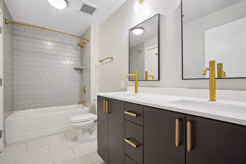 The Granary Apartments: Modern bathroom with elegant fixtures and spacious design