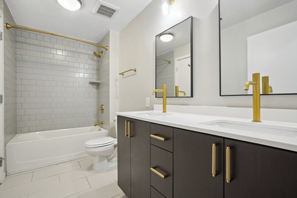 The Granary Apartments: Modern bathroom with elegant fixtures and spacious design