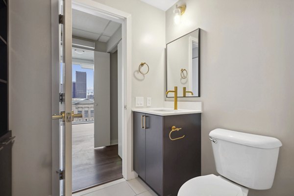 Elegant bathroom with marble countertops and modern fixtures in The Granary Apartments