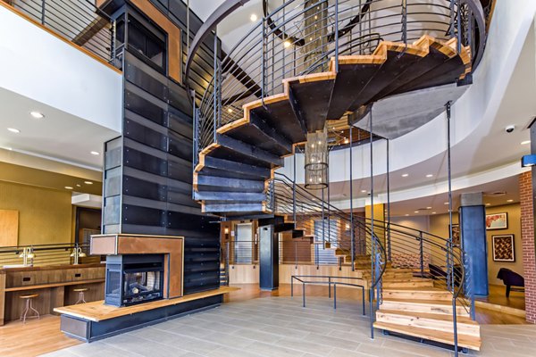 Elegant clubhouse with stylish seating and vibrant artwork at The Granary Apartments luxury community