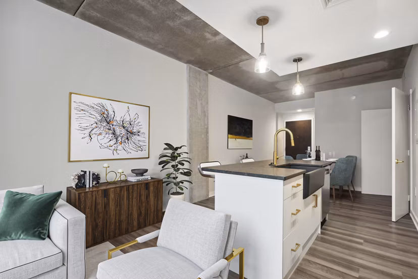 Chic kitchen with marble countertops and modern fixtures in The Granary Apartments