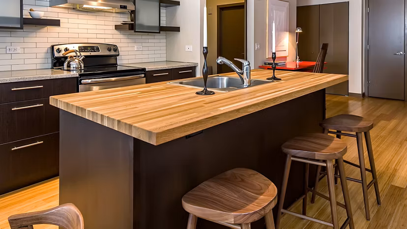 Modern kitchen with stainless steel appliances at The Granary Apartments, luxury living by Greystar