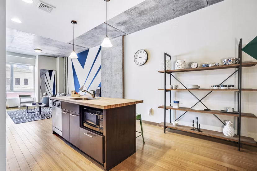 Contemporary kitchen with stainless steel appliances at The Granary Apartments, offering luxury living in a vibrant community
