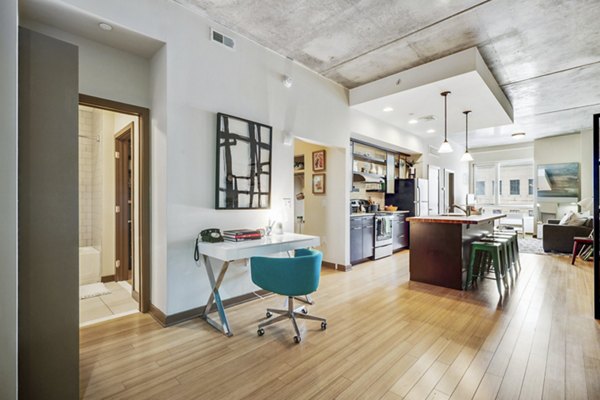 Cozy living room with natural light at The Granary Apartments
