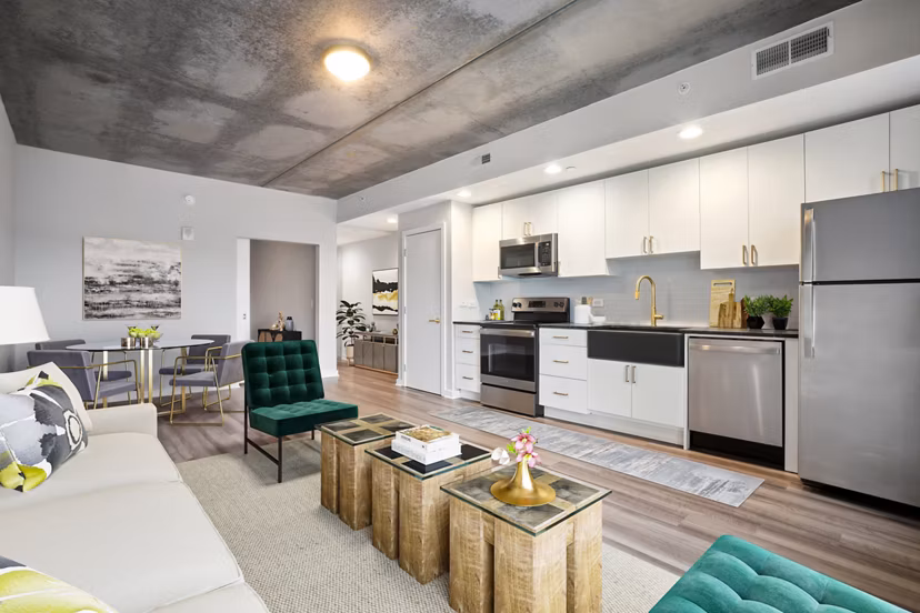 Living room with modern decor and abundant natural light at The Granary Apartments, Greystar luxury property