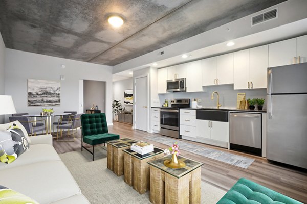 Living room with modern decor and abundant natural light at The Granary Apartments, Greystar luxury property