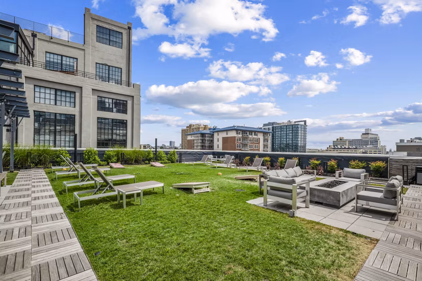 Patio seating and barbecue area at The Granary Apartments, perfect for outdoor relaxation and social gatherings