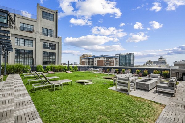 Patio seating and barbecue area at The Granary Apartments, perfect for outdoor relaxation and social gatherings