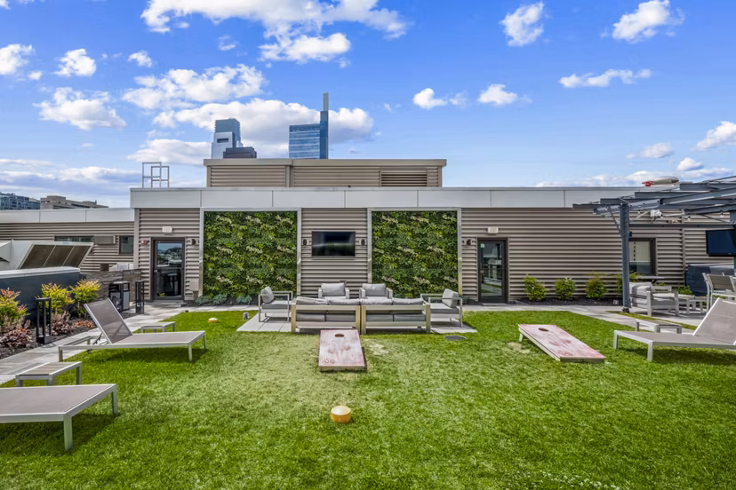 Patio with cozy seating and fire pit at The Granary luxury apartments, ideal for relaxation and outdoor gatherings