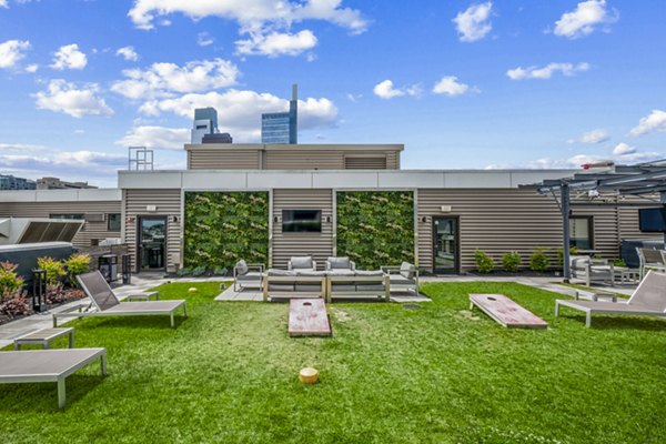 Patio with cozy seating and fire pit at The Granary luxury apartments, ideal for relaxation and outdoor gatherings