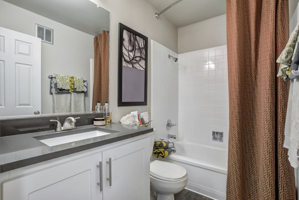 Bathroom with modern fixtures and sleek design at Park Kiely Apartments, a luxury offering by Greystar in West San Jose, California