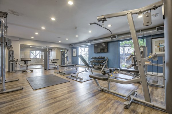 Modern fitness center with state-of-the-art equipment at Park Kiely Apartments in San Jose