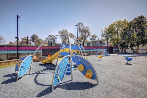 Colorful playground equipment at Park Kiely Apartments, luxury family-friendly community in Santa Clara