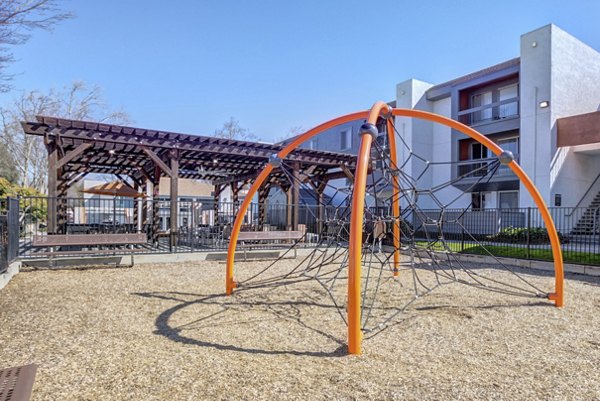 Colorful playground equipment at Park Kiely Apartments, providing recreational fun for families in a vibrant community