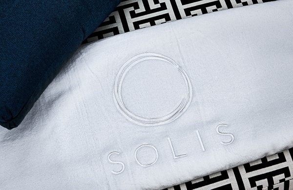 Solis SouthPark Apartments: Elegant patio with modern seating and lush greenery, offering luxury living in vibrant SouthPark neighborhood