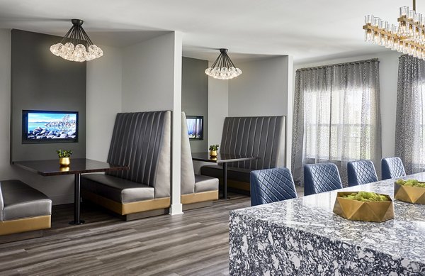 Clubhouse with modern amenities at Solis SouthPark Apartments, perfect for socializing and relaxation in a luxury setting