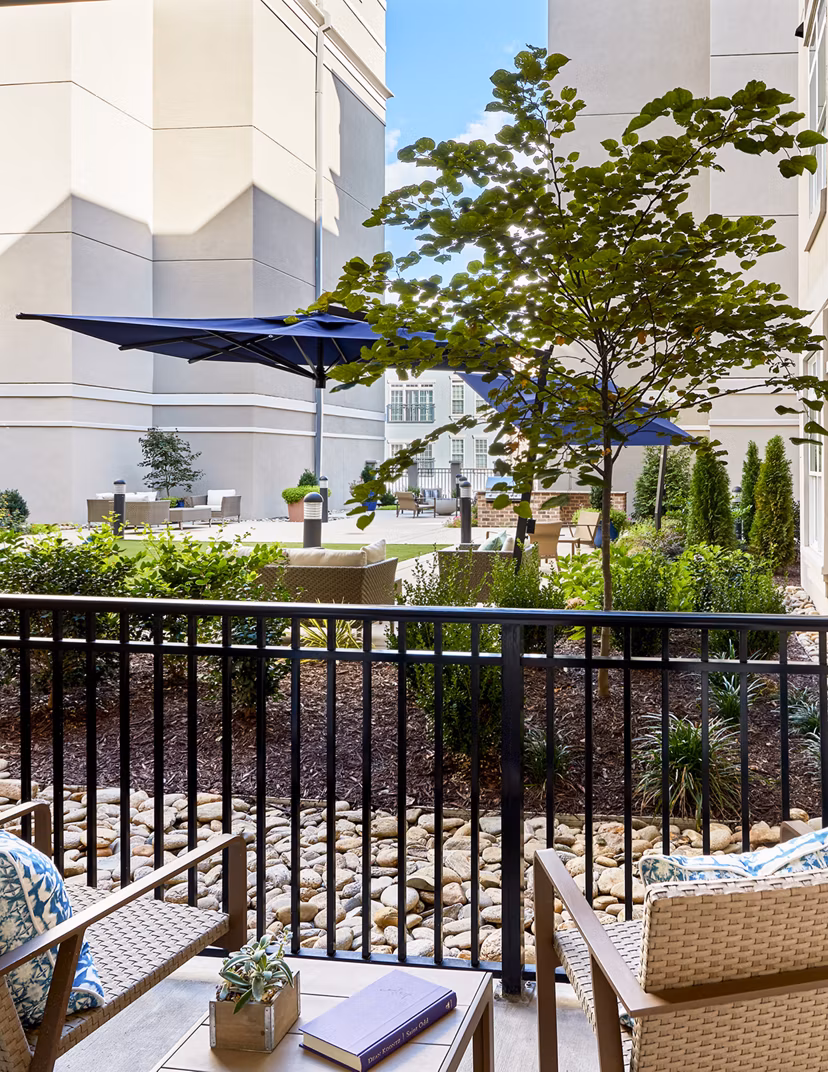 Balcony with modern furnishings at Solis SouthPark luxury apartments, ideal for relaxation and scenic views
