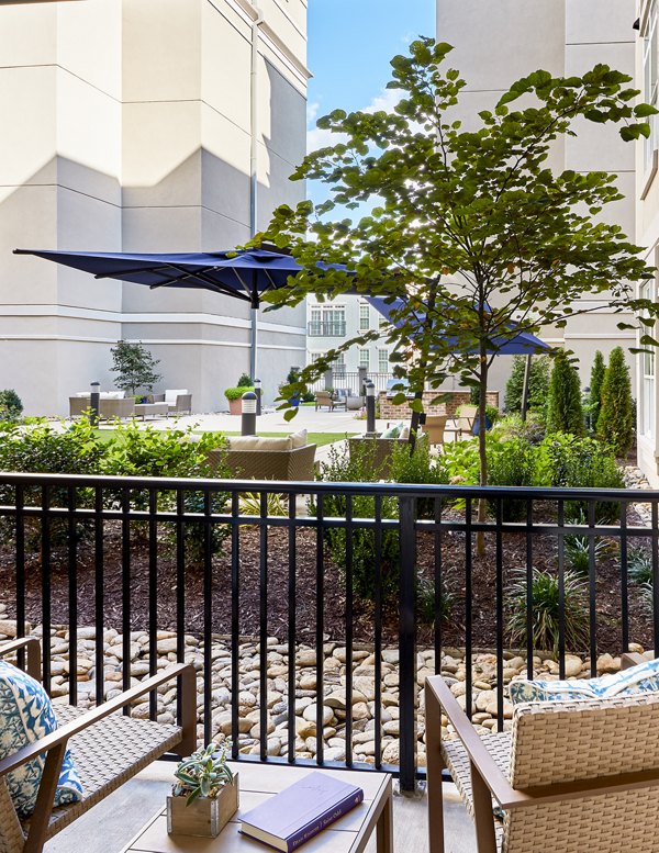 Balcony with modern furnishings at Solis SouthPark luxury apartments, ideal for relaxation and scenic views