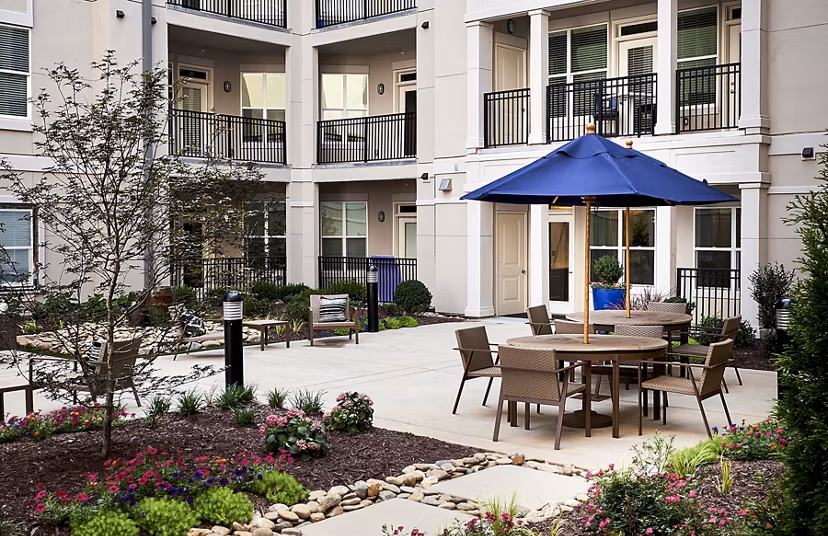 Solis SouthPark Apartments: Chic patio with comfortable seating for relaxation in luxury apartments