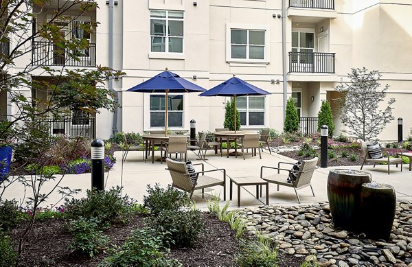 Scenic patio with modern seating at Solis SouthPark Apartments, offering luxury outdoor living experience
