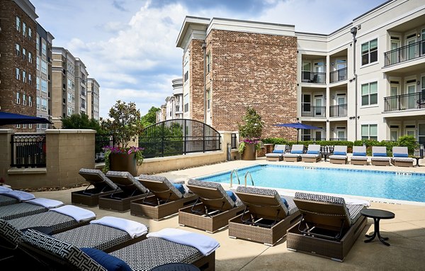 Poolside relaxation area at Solis SouthPark Apartments with luxurious seating and stunning views