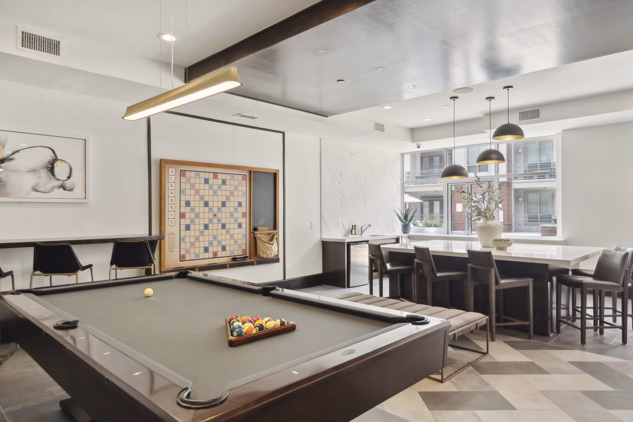 clubhouse game room at Alara Uptown Apartments