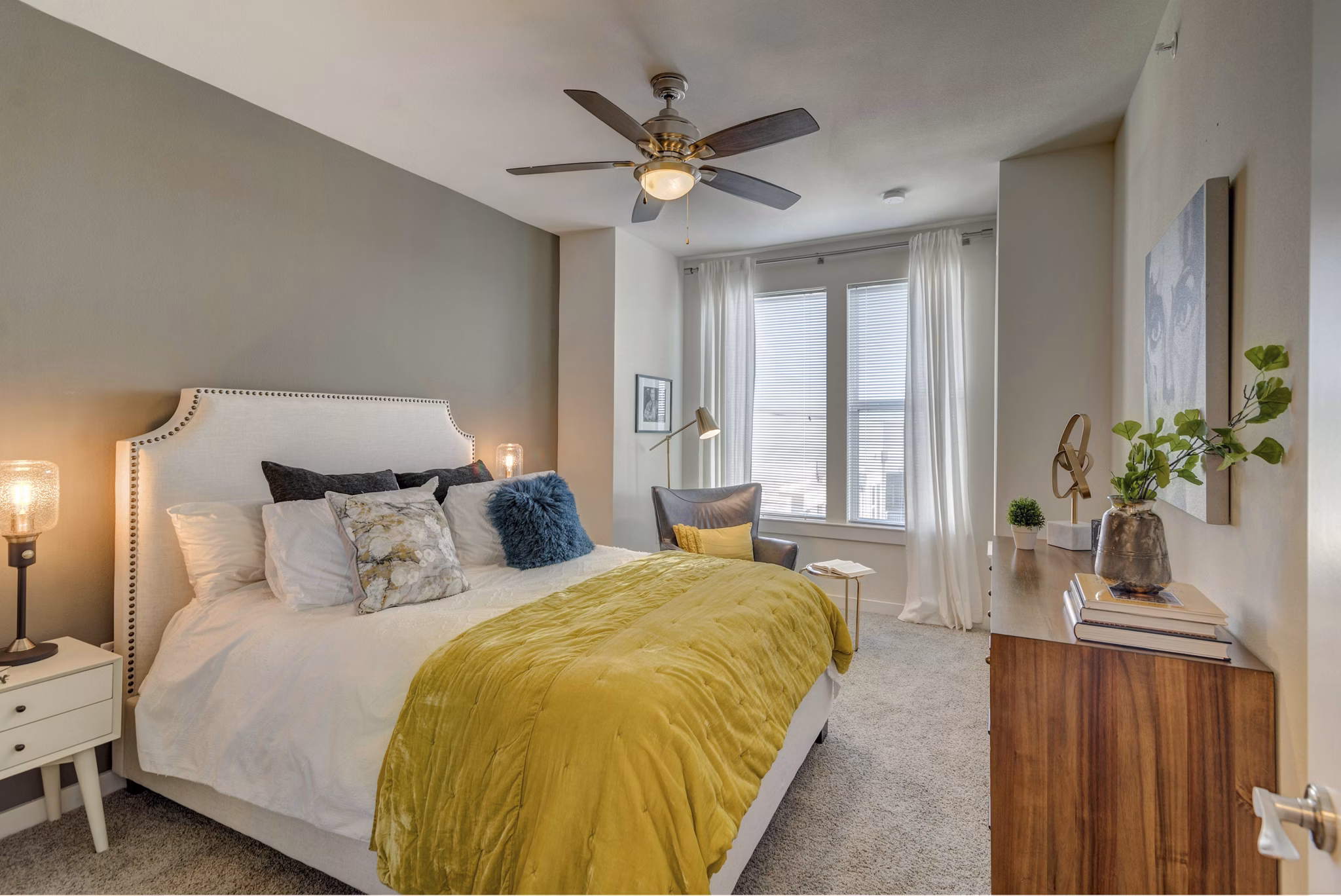 Spacious bedroom with modern furnishings at Burnet Flats Luxury Apartments