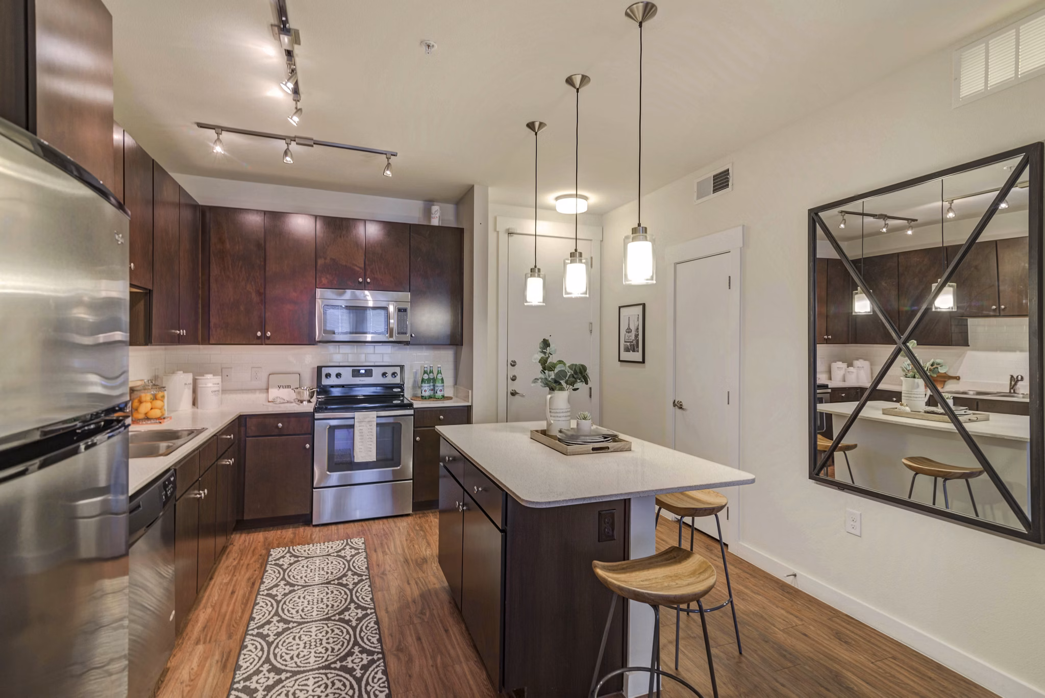Modern kitchen with sleek cabinetry and stainless steel appliances at Burnet Flats Luxury Apartments