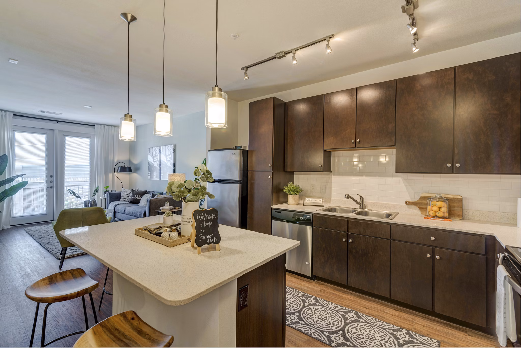 Modern kitchen with sleek countertops and stainless steel appliances at Burnet Flats Luxury Apartments