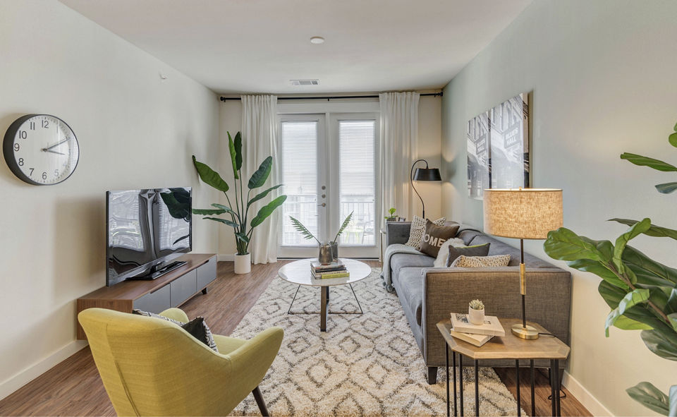 Spacious living room with modern decor at Burnet Flats Luxury Apartments