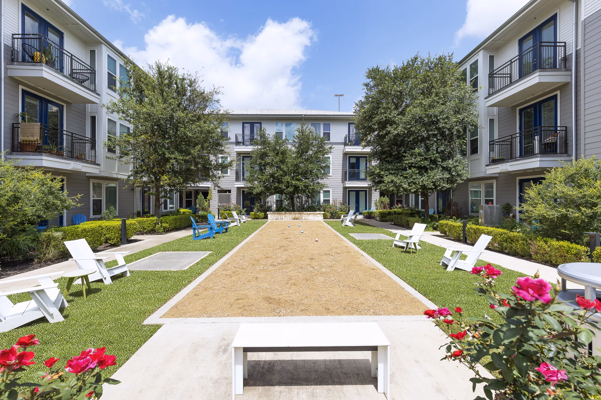 Open-air courtyard with lush landscaping at Burnet Flats Luxury Apartments in Austin