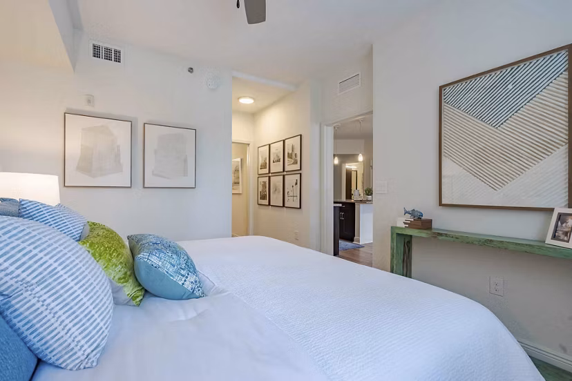 Elegant bedroom with modern furnishings in 2 Bayshore Apartments, showcasing luxury living in a serene environment