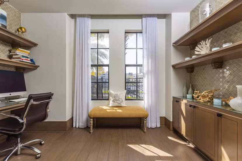 Modern business center with sleek workstations at 2 Bayshore Apartments