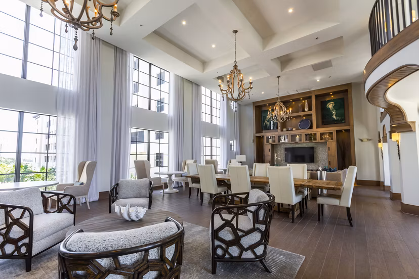 Clubhouse featuring modern lounge seating and gaming area at 2 Bayshore Apartments