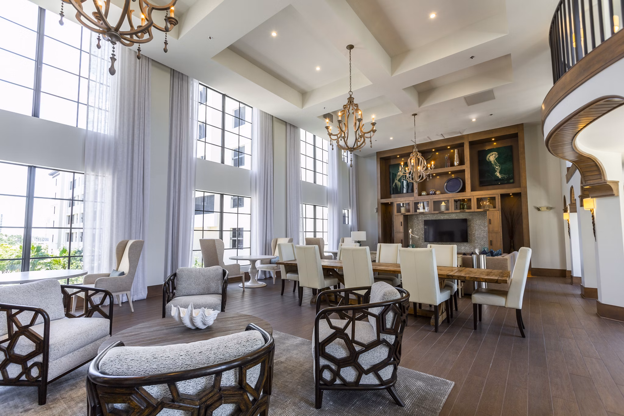 Clubhouse featuring modern lounge seating and gaming area at 2 Bayshore Apartments