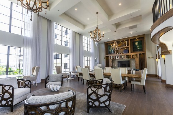 Clubhouse featuring modern lounge seating and gaming area at 2 Bayshore Apartments