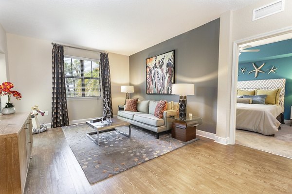Living room featuring modern decor and natural light at 2 Bayshore Apartments