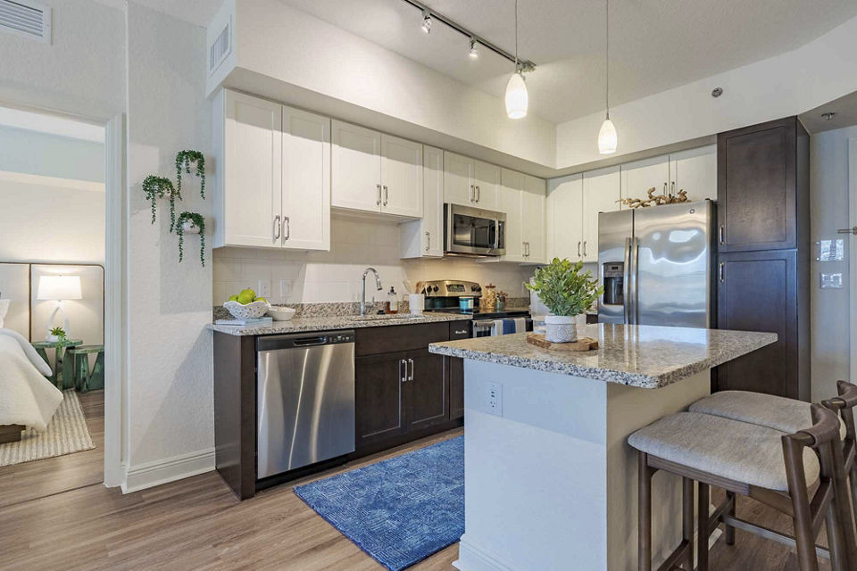 Living room featuring modern decor and natural light at 2 Bayshore Apartments