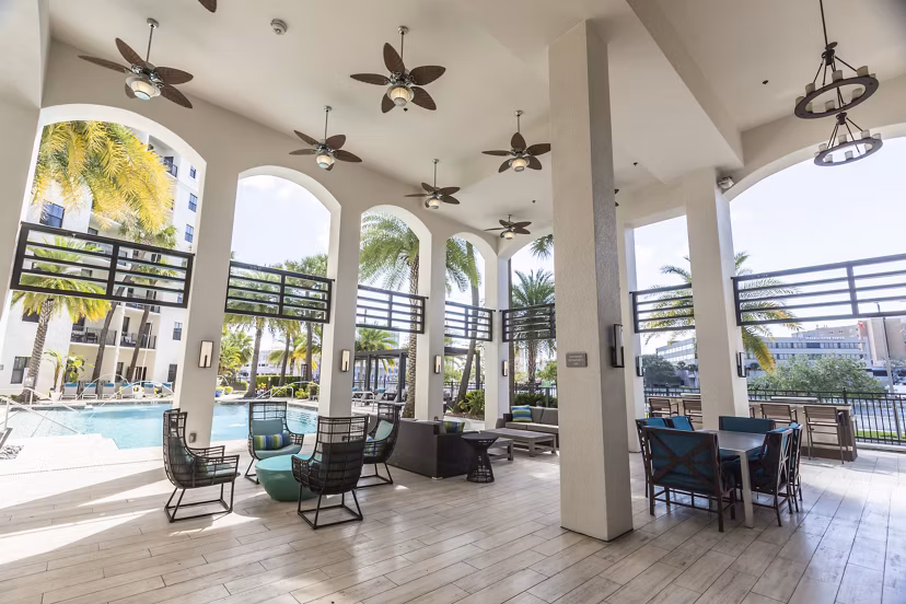 Outdoor patio with stylish seating at 2 Bayshore Apartments, offering a luxurious living experience near the waterfront
