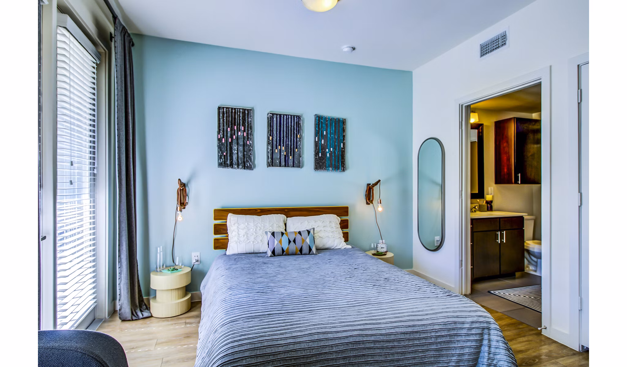Cozy bedroom with modern decor and natural light at Elan East Apartments