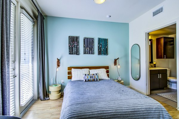 Spacious bedroom with modern decor at Elan East Apartments